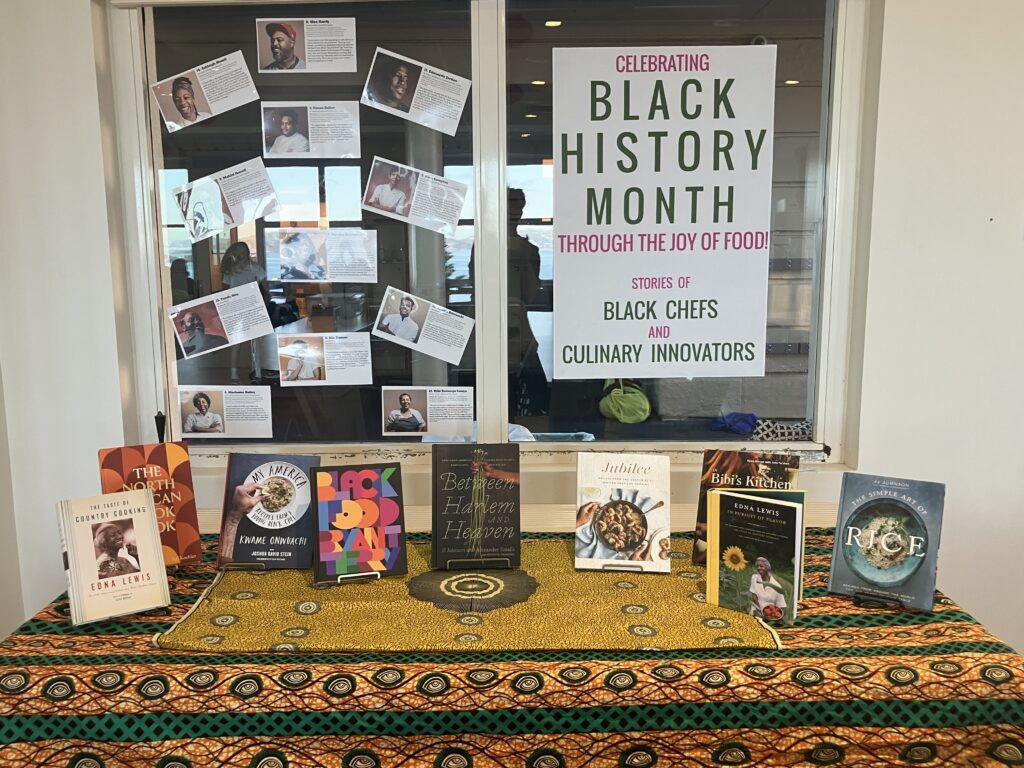 Photo of a Black History Month poster with photos and cookbooks from black chefs and culinary innovators