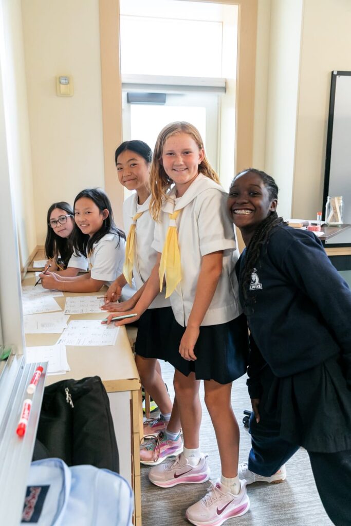 Students smiling in a row