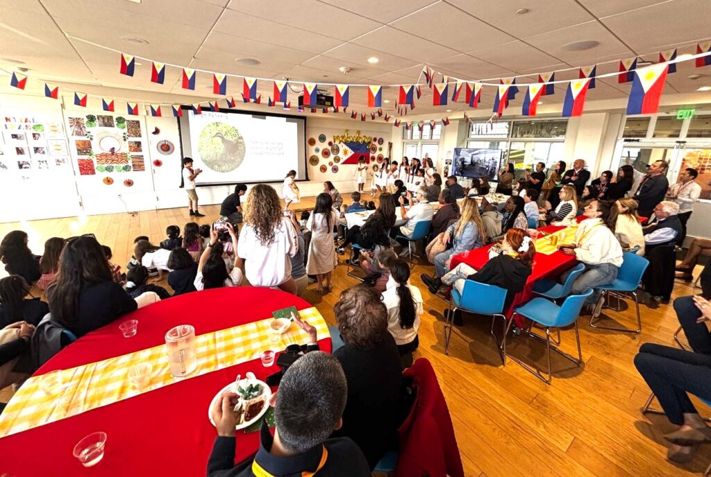 Cultural event with many attendees and flags